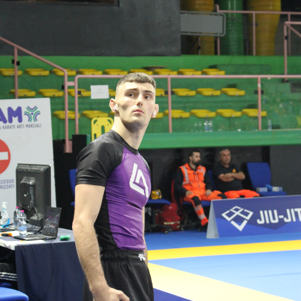 Purple belt male Roger Gracie Bristol competitor about to walk on to the mats to compete.